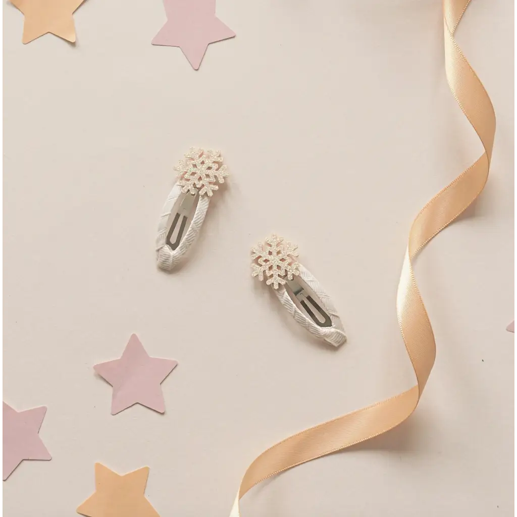 Two shimmer snowflake clips on ribbon wrapped snaps perfect for winter vibes