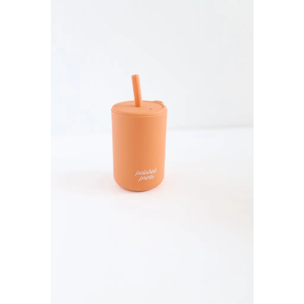 Peach silicone cup with straw perfect for sipping, part of the Silicone Straw Cups collection