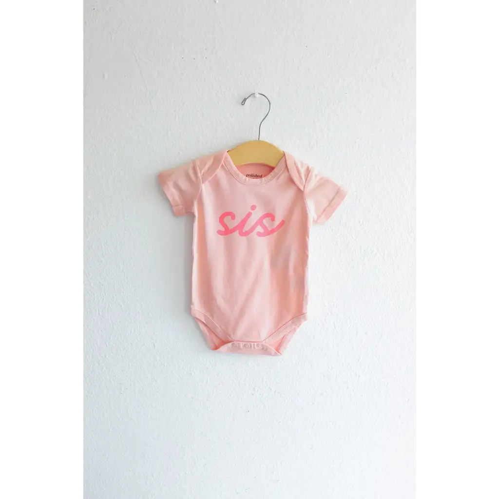 Pink sis organic cotton onesie for baby sister making her debut in style