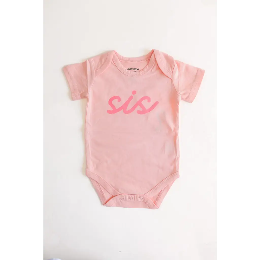 Pink sis organic cotton onesie for baby sister making her debut in cute style