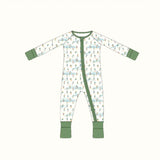 Cute bamboo baby sleeper with white onesie, green trim, and playful ski pattern