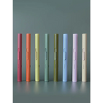 Eight pastel-colored pens beside a solid flameless rechargeable lighter for clean igniting