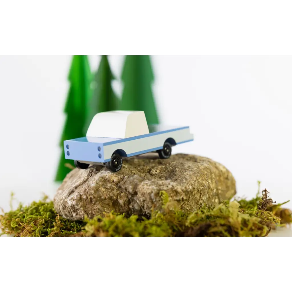 Light blue Sonora Pickup Toy sitting on a rock near the Lone Cactus Motel