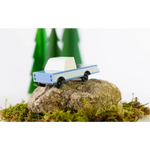 Light blue Sonora Pickup Toy sitting on a rock near the Lone Cactus Motel