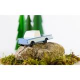 Light blue Sonora Pickup Toy sitting on a rock near the Lone Cactus Motel