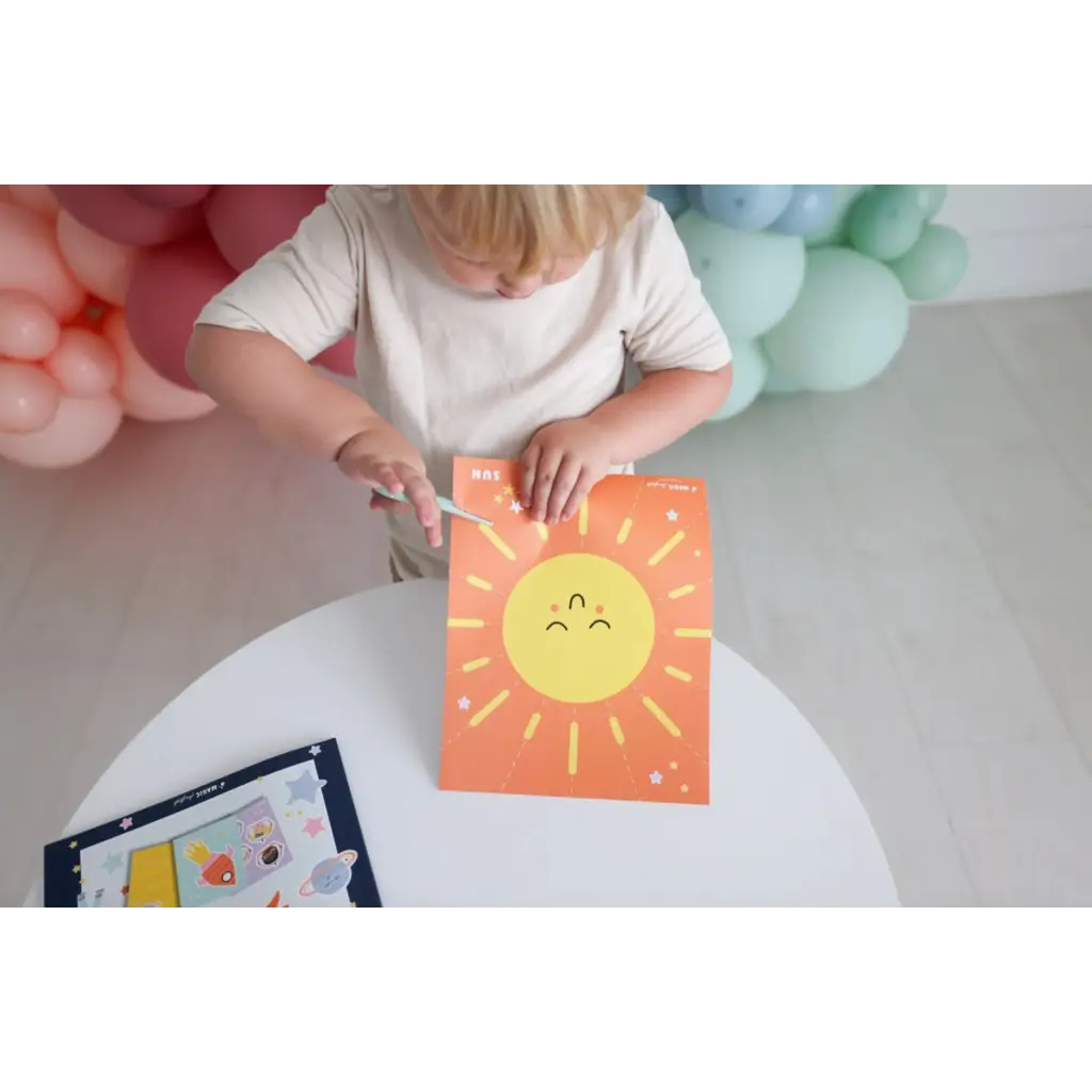 Orange paper with a smiling sun drawing for Space Scissor Skills Activity Kit