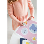 Pink knit dress with gathered waist, perfect for the Space Scissor Skills Activity Kit