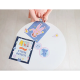 Hands arranging colorful cards for the Space Scissor Skills Activity Kit