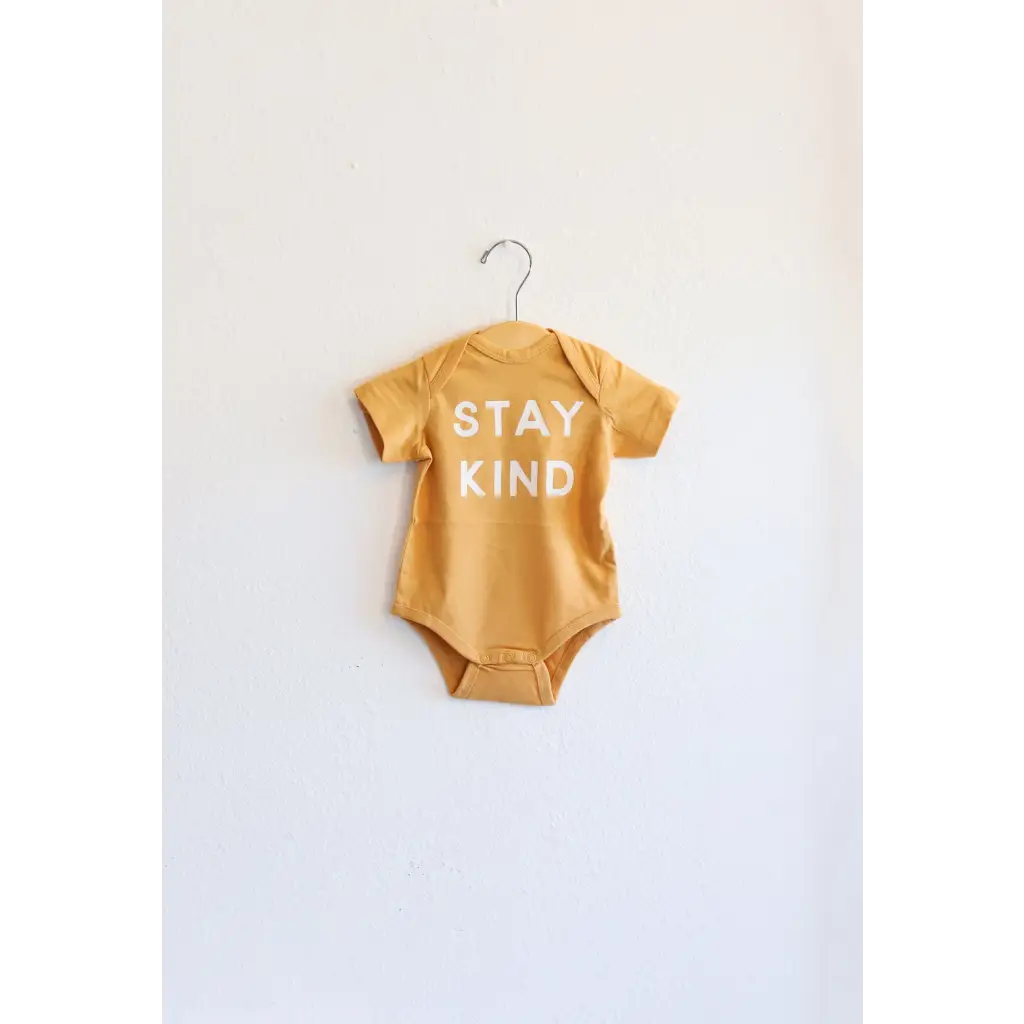 Stay Kind Organic Baby Onesie in yellow made from soft organic cotton fabric