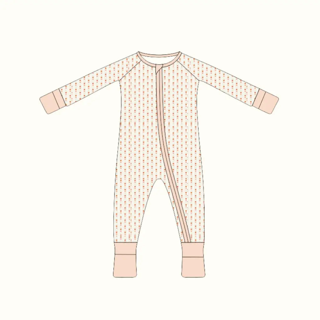 Cute baby sleeper with diagonal zipper, pink cuffs, and subtle pattern, perfect bamboo baby sleeper