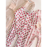 Polished white bamboo baby sleeper with red strawberry prints and zipper