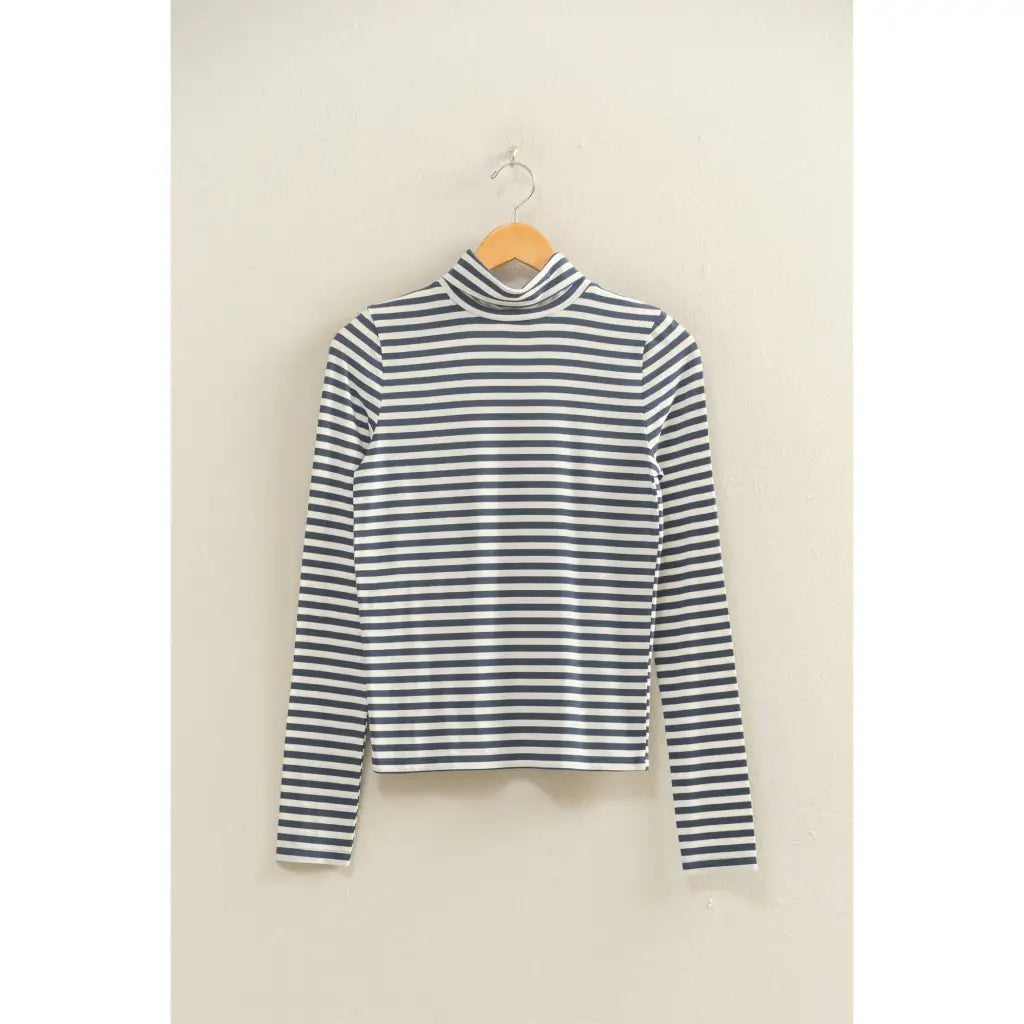 Striped turtleneck fitted top with navy stripes on white