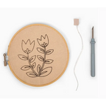 Embroidery hoop with floral punch needle design from Summer Tulips Punch Needle Kit