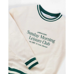 White sweatshirt with green trim perfect for Sunday Morning Leisure Club vibes