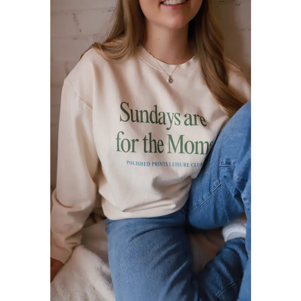 Cream-colored Sunday morning sweatshirt with Moms text and Polished Prints logo