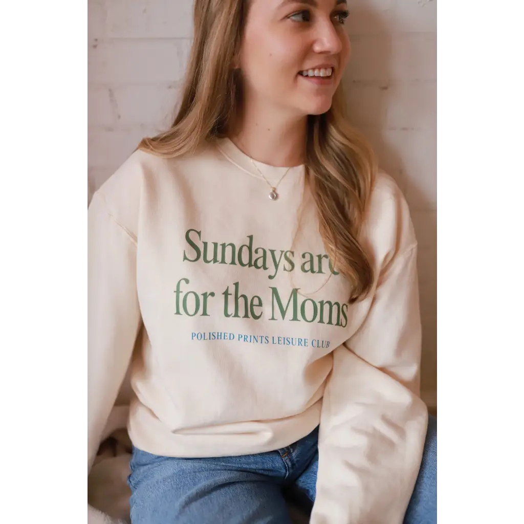 Cream-colored Sunday morning sweatshirt with Sundays Are For The Moms text