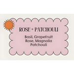 Pink scalloped label for Supermom Vibes Candle showing Rose + Patchouli fragrance notes