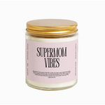 White candle in a jar with gold lid and Supermom Vibes label, perfect for creating small batches