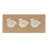 Elegant white swan candles with glossy finish and textured details