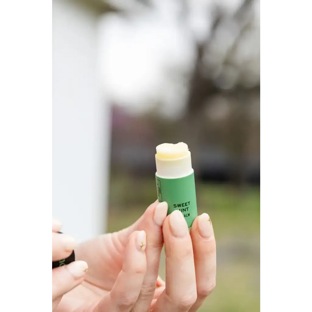 Sweet Mint Organic Lip Balm green tube with yellow balm top