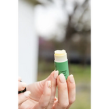 Sweet Mint Organic Lip Balm green tube with yellow balm top