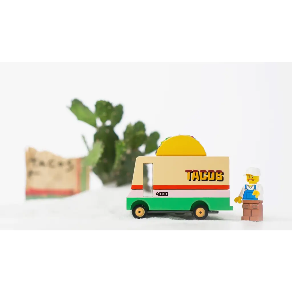 Colorful Taco Truck Toy with LEGO minifigure next to fun food trucks vibe