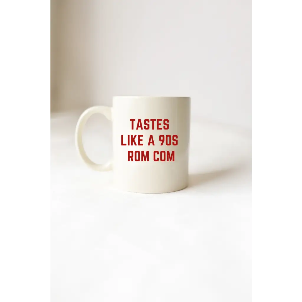 Ceramic mug with red text for Tastes Like a 90s Rom Com, perfect for stylish women’s clothes