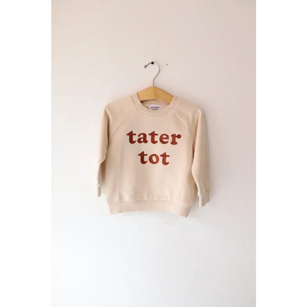 Cream-colored sweatshirt with Tater Tot text for stylish tot kids pullover fun