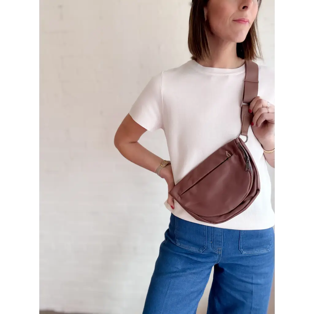 Brown leather crossbody bag from The Adventure Crossbody Bag, perfect for stylish womens clothes