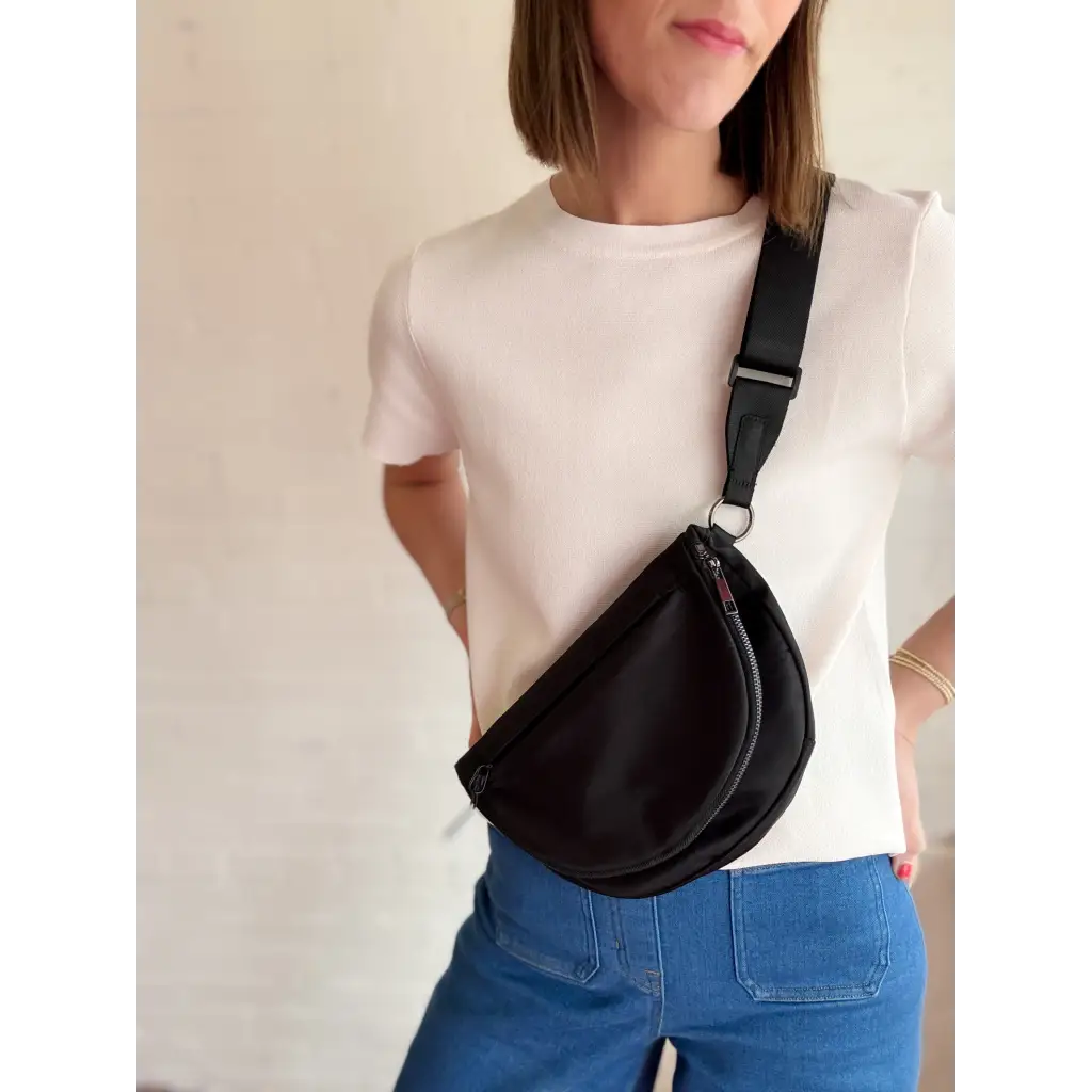 Stylish black crescent-shaped Adventure Crossbody Bag for on-the-go vibes