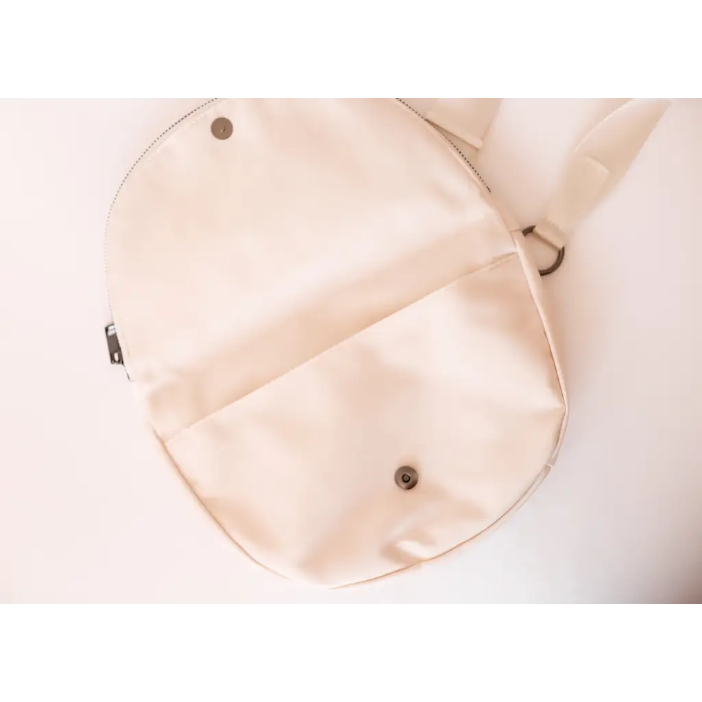 Open light-colored Adventure Crossbody Bag in Ivory, perfect for stylish moms on the go