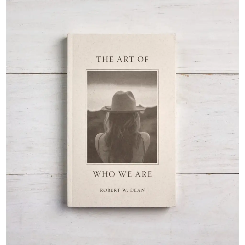 Book The Art of Who We Are by Robert W. Dhan with stylish black and white cover art