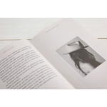 Open book showcasing text and black and white photo from The Art of Who We Are