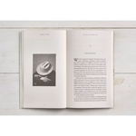 Open book showcasing polished prints on the left and stylish text for moms on the right