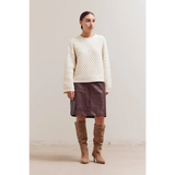 Cozy Betsy Crew Knit sweater with brown leather skirt and tan boots
