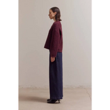 Maroon Betsy Crew Knit sweater with navy pants and black heels