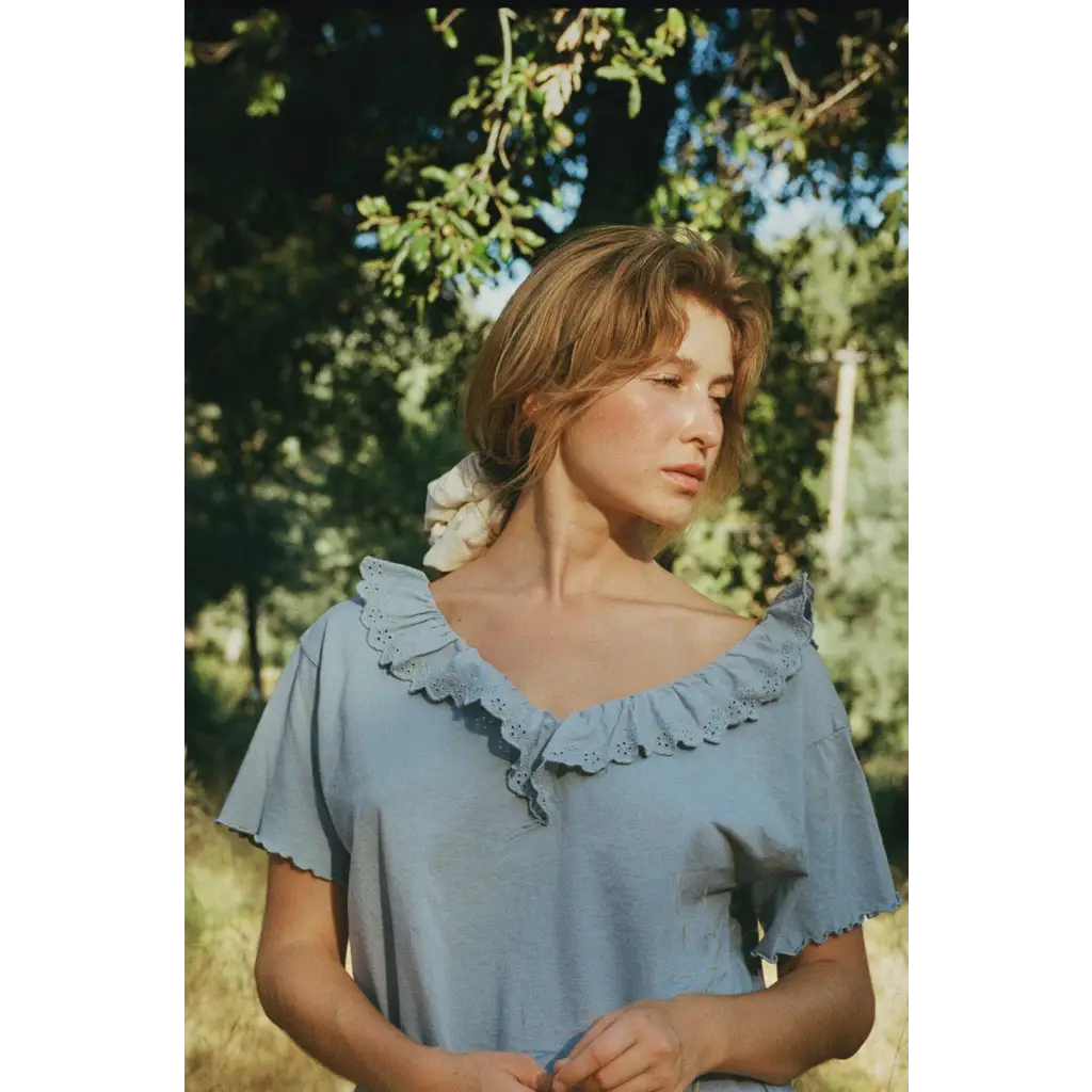Cottage tee in light blue cotton with eyelet lace trim and flutter sleeves