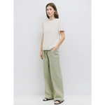 Woman in a casual linen outfit wearing The Deanna Top, ideal stylish womens clothes