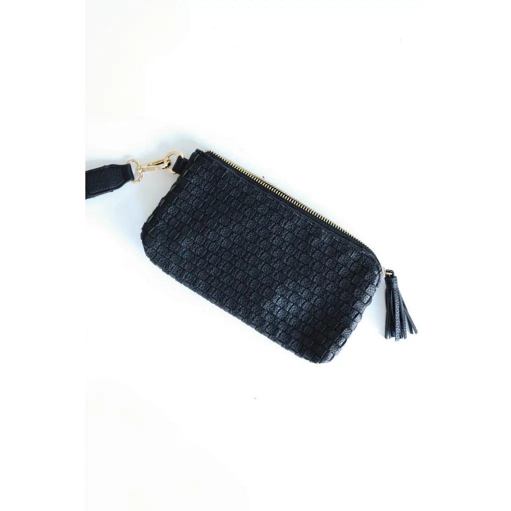 Black woven leather Devin Clutch with tassel zipper pull for the perfect combination of style