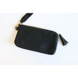 Stylish Devin Clutch in solid black with woven leather, zipper, and tassel detail