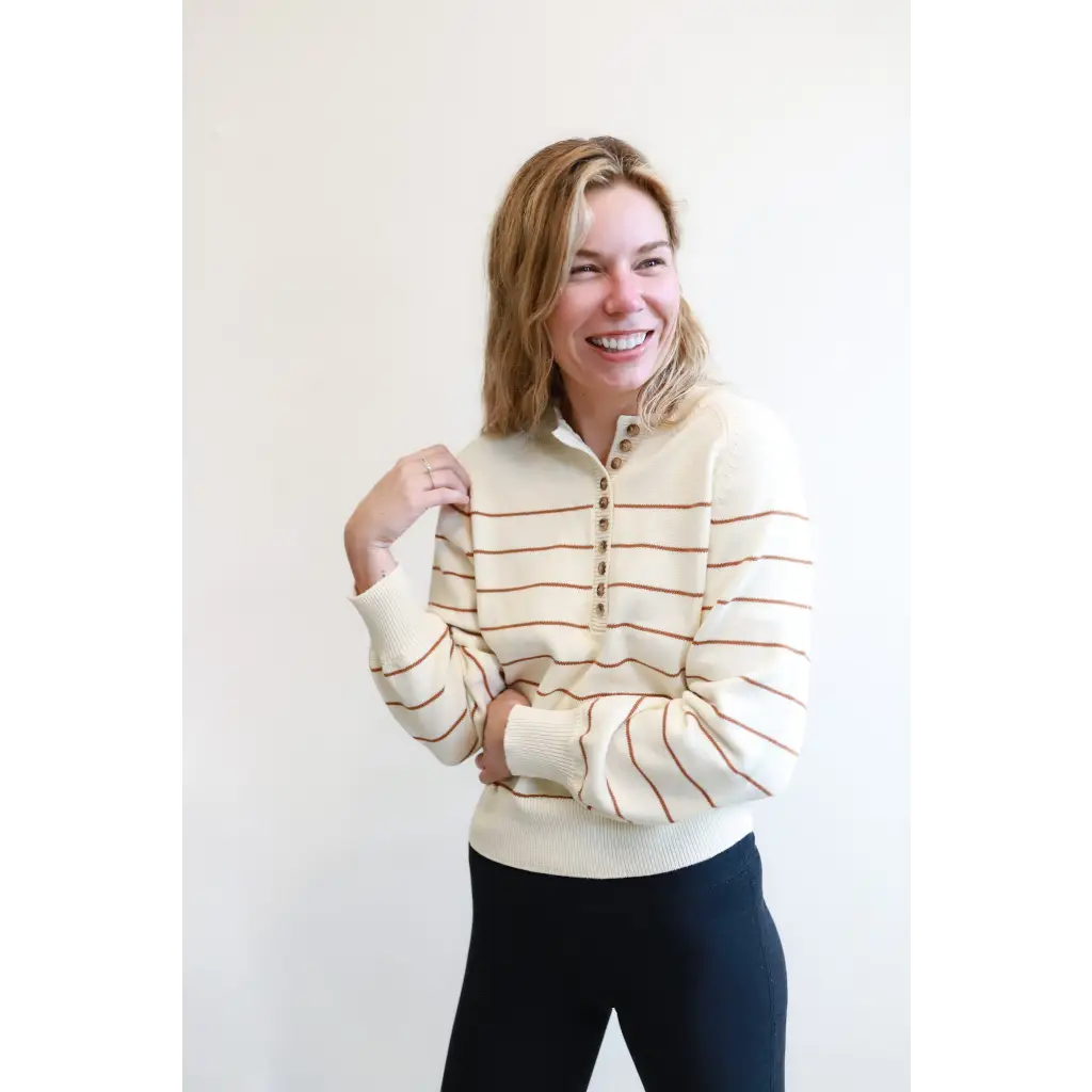 Cream-colored Ellen Henley Sweater with brown stripes, perfect for classic style lovers