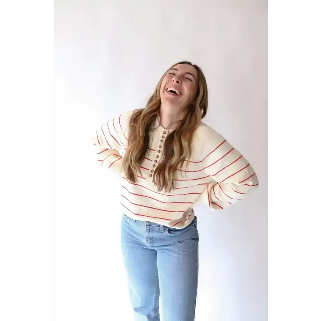 Striped red white sweater with blue jeans and three peace signs camp vibe