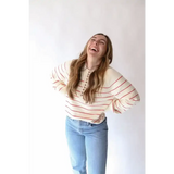 Striped red white sweater with blue jeans and three peace signs camp vibe