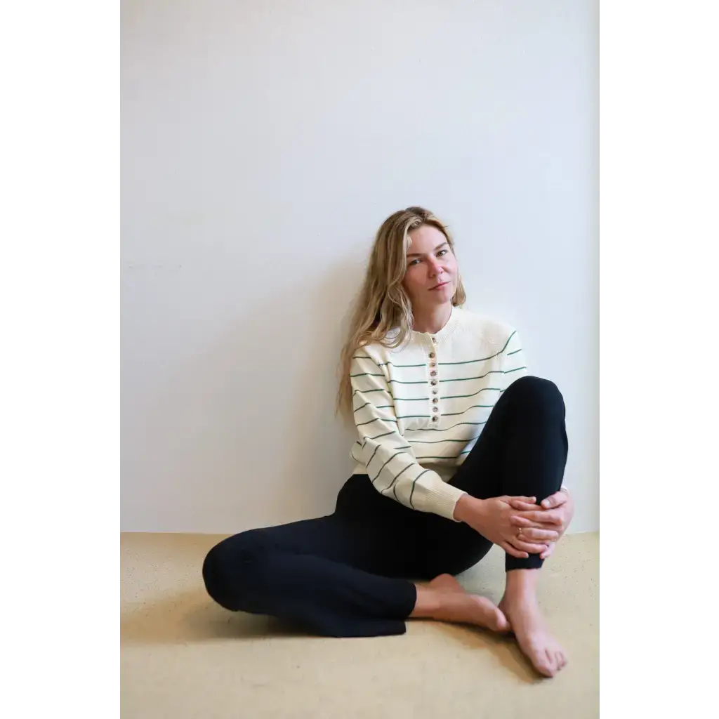 Green Ellen Henley Sweater with stripes, black leggings, beige buttons