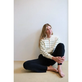 Green Ellen Henley Sweater with stripes, black leggings, beige buttons