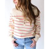 Cream-colored Ellen Henley Sweater with red stripes and buttons, perfect for peace signs camp