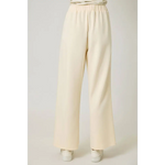 Cream-colored tracksuit pants with elastic waistband and rust stripes, perfect for casual wear