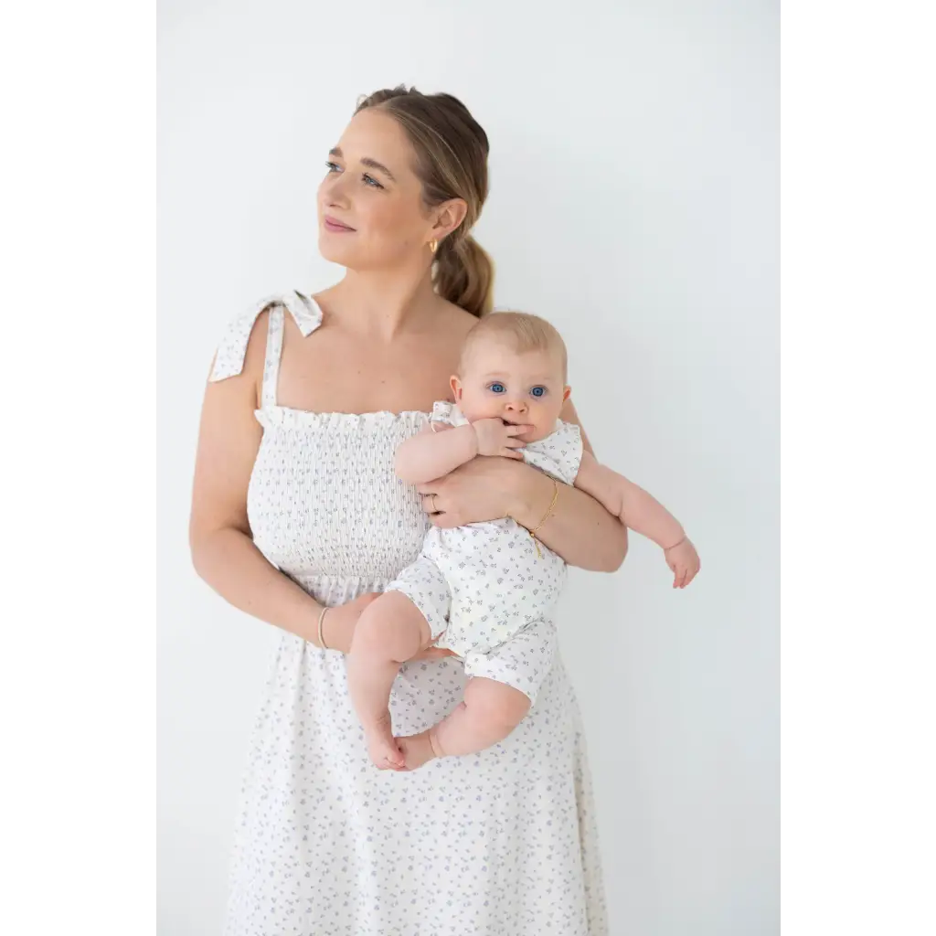 Mother and baby in matching white eyelet dresses with super soft organic cotton henley romper
