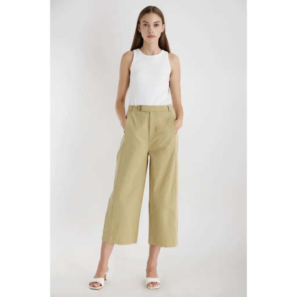 Woman in The Ivette Basic Tank, pairing it with khaki culottes for stylish womens clothes