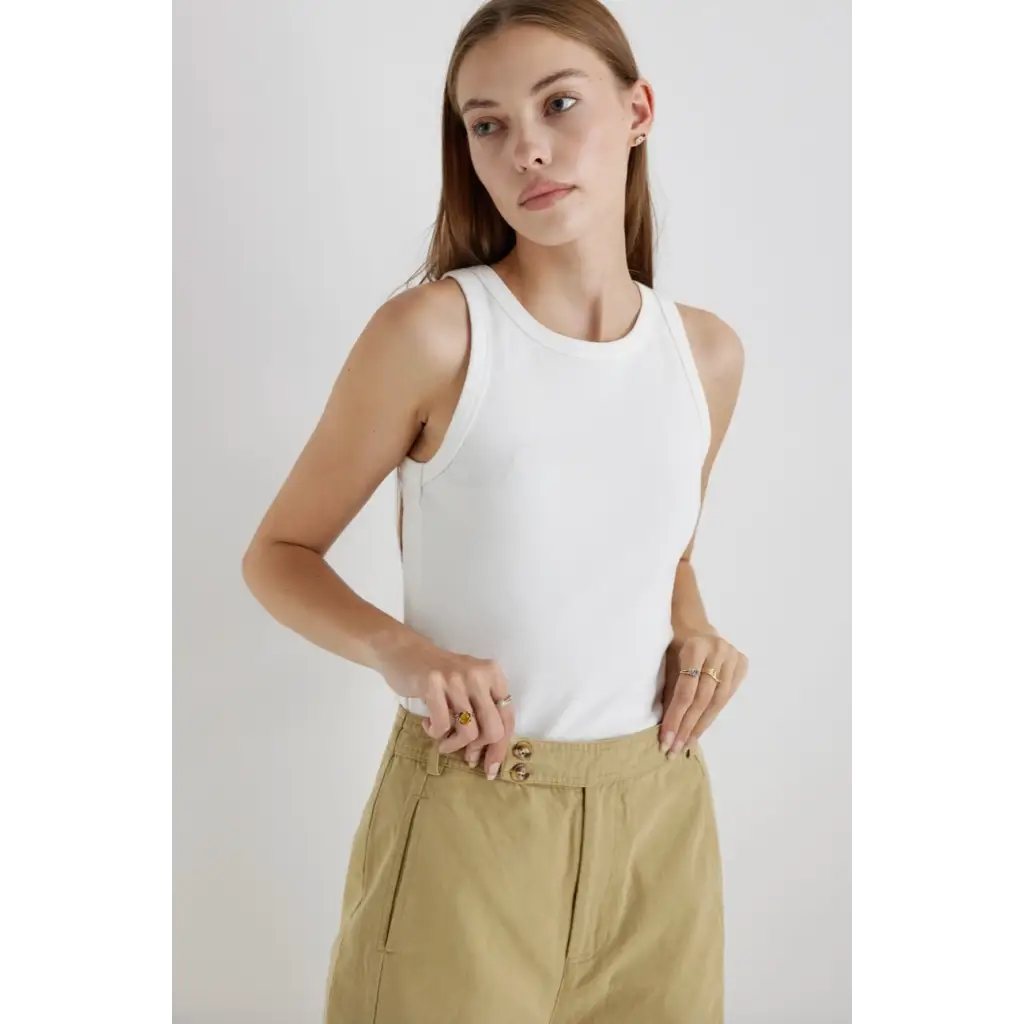 Woman’s white tank top and khaki pants, stylish womens clothes for any occasion